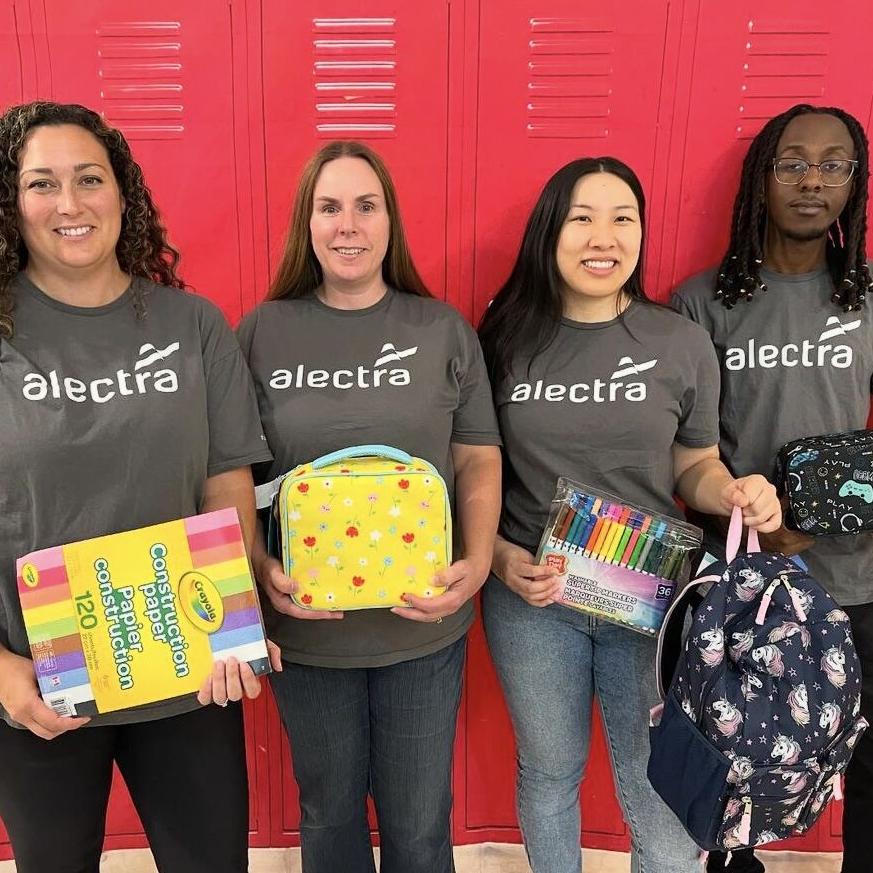 group photo with school supplies donation